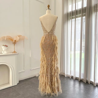 Champagne Dreams 2024: Luxury Feathered Mermaid Evening Dress with Spaghetti Straps, Perfect for Women at Weddings and Proms.