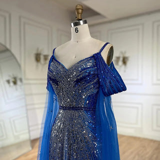 Ships in 1 to 3 Days - 2024 Spaghetti Strap Blue Mermaid Beaded Evening Gown with Cape Sleeves - Luxury Dress