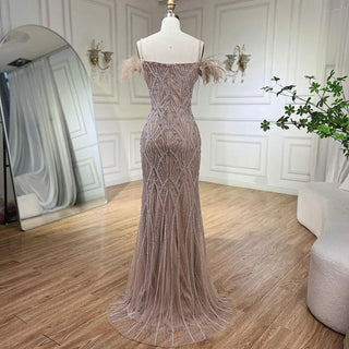 Nude Spaghetti Straps Elegant Mermaid Evening Gown 2024 with Luxury Beaded Feathers - Perfect for Women's Parties