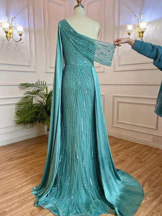 Golden Mirage: One-Shoulder Champagne Mermaid Evening Gown with Beaded Cape Sleeve - Dubai-Inspired Elegance for Arabic Weddings and Grand Celebrations.