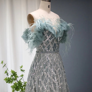 Emerald Enchantment: 2024 Dubai Feathered Gown with Elegant Off Shoulder Design for Wedding Celebrations.