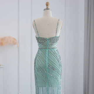 Dubai Sunset Radiance: Orange Spaghetti Straps Mermaid Evening Dress with Luxury Crystal Embellishments, Perfect for Women at Wedding Parties and Proms.