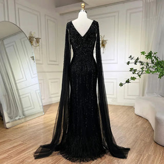 Midnight Majesty: 2024 Black Mermaid Evening Gown with Cape Sleeves and High Split - Luxury Beaded Feathers Dress for Women's Party