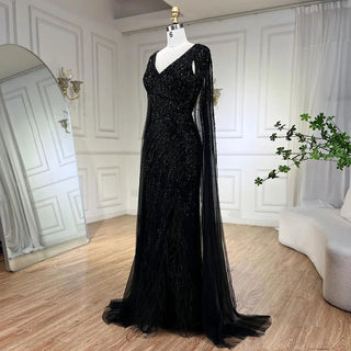 Midnight Majesty: 2024 Black Mermaid Evening Gown with Cape Sleeves and High Split - Luxury Beaded Feathers Dress for Women's Party