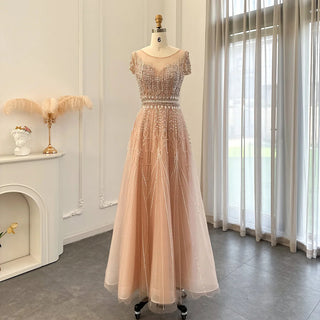 Golden Blush Elegance: Beaded Pale Pink Plus Size Evening Gown with Arabic-inspired Glamour for Weddings and Formal Occasions.