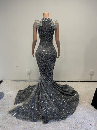 Opulent Crystal Embellished Gown with Dramatic High Slit and Feather Accents