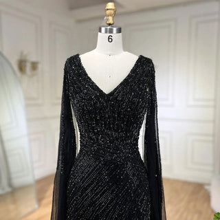 Midnight Majesty: 2024 Black Mermaid Evening Gown with Cape Sleeves and High Split - Luxury Beaded Feathers Dress for Women's Party