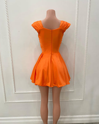 Vibrant Orange Mini Dress with Silver Floral Embellishments and Layered Pearl Chains