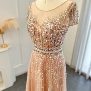 Golden Blush Elegance: Beaded Pale Pink Plus Size Evening Gown with Arabic-inspired Glamour for Weddings and Formal Occasions.