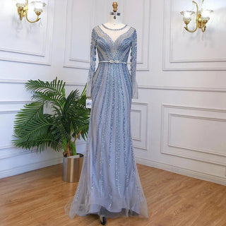 Dubai Sapphire Elegance: Luxury Blue Mermaid Evening Dress with Long Sleeves, Beaded Details, and a Belt, Ideal for Arabic Women at Wedding and Formal Parties.