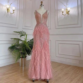 Dubai Pink Plume: Luxury Pink Feathered Evening Dress with Gold Accents and a V-Neck, Perfect for Women at Weddings and Formal Parties.