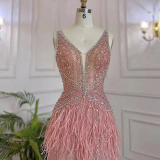 Dubai Pink Plume: Luxury Pink Feathered Evening Dress with Gold Accents and a V-Neck, Perfect for Women at Weddings and Formal Parties.