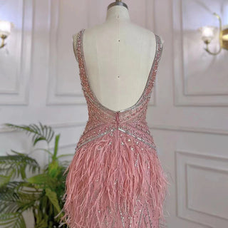 Dubai Pink Plume: Luxury Pink Feathered Evening Dress with Gold Accents and a V-Neck, Perfect for Women at Weddings and Formal Parties.