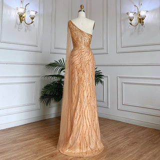 Desert Blossom: One-Shoulder Blush Pink Mermaid Evening Gown with Cape, Accented in Dubai-Inspired Emerald Green - A Luxurious Ensemble for Weddings and Grand Parties.