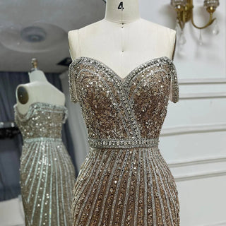 Caramel Spaghetti Strap Mermaid Gown with Feather and Beaded Detailing - Luxury Saudi Evening Dress for Formal Occasions