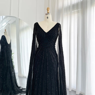 Exquisite 2024 Arabic Mermaid Evening Gowns in Luxurious Black: Featuring Cape Sleeves and Beaded Details for Women's Wedding and Party Attire in Dubai