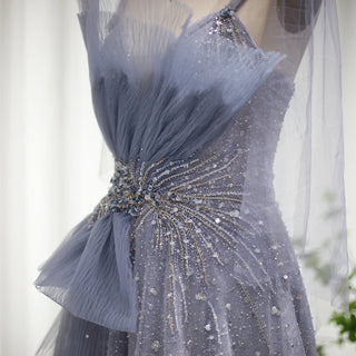 Dubai Dawn: Blush Pink Gown with Elegant Blue Accents and Spaghetti Straps for Wedding Formals.