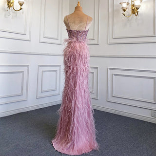 Dubai Pink Plume: 2024 Luxury Mermaid Evening Dress with Spaghetti Straps and Side Slit for Weddings and Proms.