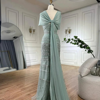 Saudi Arabic Sage Green Mermaid Evening Dress with Beaded Details and Long Cape for Formal Occasion