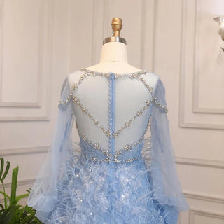 Dubai Crystal Feathers: Luxury Blue Evening Gown with Crystal Accents, Arabic-inspired Design, and Long Sleeves for Weddings, Parties, and Prom.