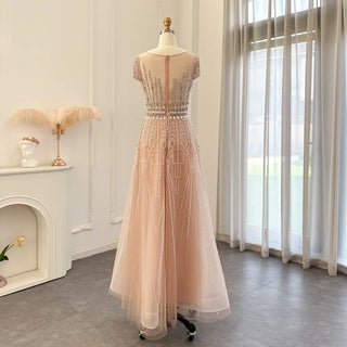 Golden Blush Elegance: Beaded Pale Pink Plus Size Evening Gown with Arabic-inspired Glamour for Weddings and Formal Occasions.