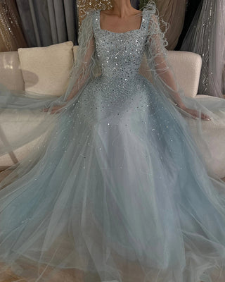 Ships in 1 to 3 Days - 2024 Arabic Blue A-Line Evening Dress - Luxury Beaded Gown with Feathers and Cape Sleeves for Formal Occasions in Saudi Arabia