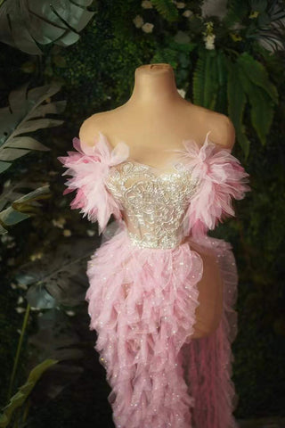 Enchanting Pink Ruffled Gown with Embellished Bodice and Feather Accents