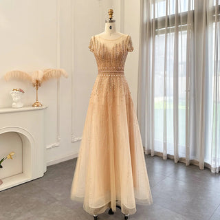 Golden Blush Elegance: Beaded Pale Pink Plus Size Evening Gown with Arabic-inspired Glamour for Weddings and Formal Occasions.