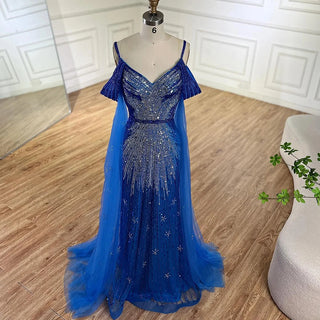 Ships in 1 to 3 Days - 2024 Spaghetti Strap Blue Mermaid Beaded Evening Gown with Cape Sleeves - Luxury Dress