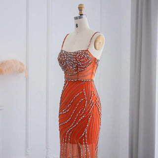 Dubai Sunset Radiance: Orange Spaghetti Straps Mermaid Evening Dress with Luxury Crystal Embellishments, Perfect for Women at Wedding Parties and Proms.