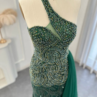 Emerald Elegance: One Shoulder Evening Dress with Overskirt, Side Slit, and Luxury Champagne Accents, Ideal for Mermaid Proms and Formal Occasions.