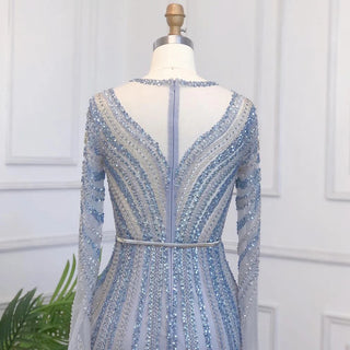 Dubai Sapphire Elegance: Luxury Blue Mermaid Evening Dress with Long Sleeves, Beaded Details, and a Belt, Ideal for Arabic Women at Wedding and Formal Parties.