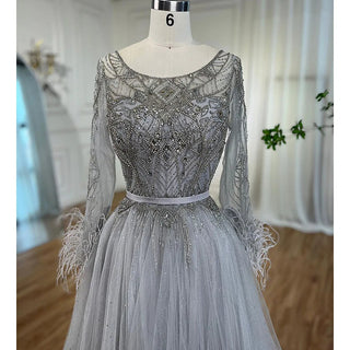 Feathered Grace: Grey A-Line Evening Gown with Beading and Feather Design – Dubai 2024 Formal Collection