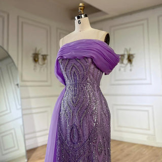 Ships in 1 to 3 Days - 2024 One-Shoulder Purple Mermaid Evening Gown with Beaded Side Skirt Overlay.