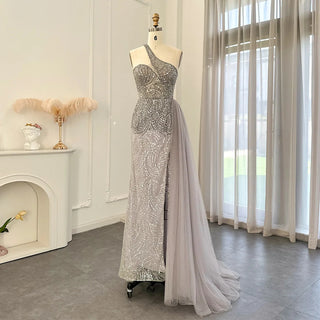 Emerald Elegance: One Shoulder Evening Dress with Overskirt, Side Slit, and Luxury Champagne Accents, Ideal for Mermaid Proms and Formal Occasions.