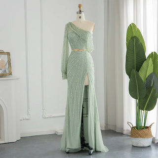 Emerald Allure: One-Shoulder Sage Green Mermaid Gown with Dubai-Inspired Gold Highlights and High Slit - A Regal Selection for Proms, Weddings, and Formal Events.