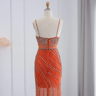 Dubai Sunset Radiance: Orange Spaghetti Straps Mermaid Evening Dress with Luxury Crystal Embellishments, Perfect for Women at Wedding Parties and Proms.