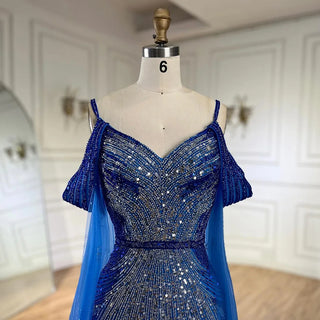 Ships in 1 to 3 Days - 2024 Spaghetti Strap Blue Mermaid Beaded Evening Gown with Cape Sleeves - Luxury Dress