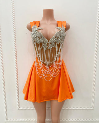 Vibrant Orange Mini Dress with Silver Floral Embellishments and Layered Pearl Chains