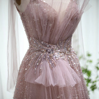 Dubai Dawn: Blush Pink Gown with Elegant Blue Accents and Spaghetti Straps for Wedding Formals.