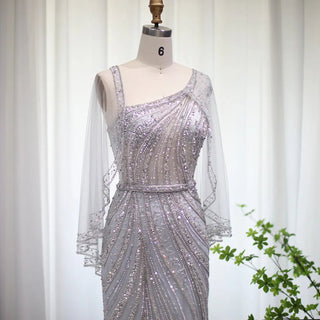 Champagne Elegance: Dubai-Inspired Mermaid Evening Gown with Silver Cape Accent - One-Shoulder Wonder for Proms, Weddings, and Grand Soirees.