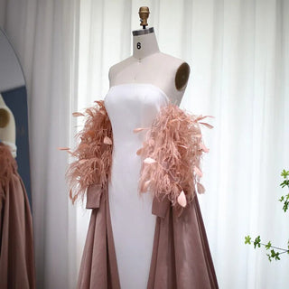 Dubai Petal Elegance: Rose Pink Feathered Gown with Cape for Women's Formal Wedding Festivities.