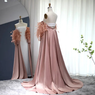 Dubai Petal Elegance: Rose Pink Feathered Gown with Cape for Women's Formal Wedding Festivities.