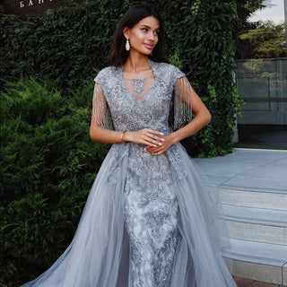 Dubai Silver Elegance: Luxury Overskirt Evening Dress with Tassel Accents, Designed for Plus Size Women, Perfect for Weddings, Parties, and Proms with Arabic Elegance.