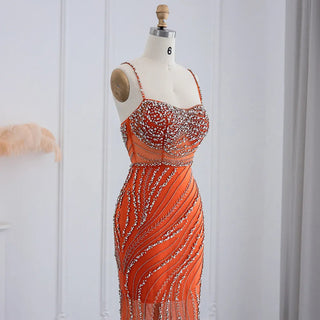 Dubai Sunset Radiance: Orange Spaghetti Straps Mermaid Evening Dress with Luxury Crystal Embellishments, Perfect for Women at Wedding Parties and Proms.