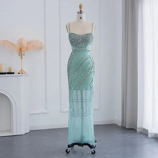 Dubai Sunset Radiance: Orange Spaghetti Straps Mermaid Evening Dress with Luxury Crystal Embellishments, Perfect for Women at Wedding Parties and Proms.