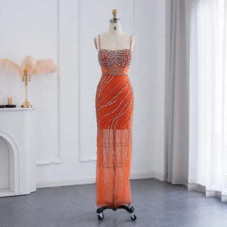 Dubai Sunset Radiance: Orange Spaghetti Straps Mermaid Evening Dress with Luxury Crystal Embellishments, Perfect for Women at Wedding Parties and Proms.