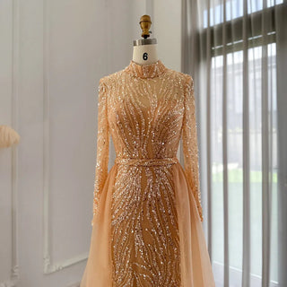 Golden Elegance: Mermaid Arabic Evening Gown with Luxurious Overskirt and Long Sleeves - A Regal Choice for Muslim Wedding Celebrations and Formal Affairs.