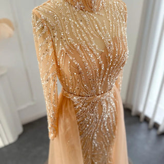 Golden Elegance: Mermaid Arabic Evening Gown with Luxurious Overskirt and Long Sleeves - A Regal Choice for Muslim Wedding Celebrations and Formal Affairs.