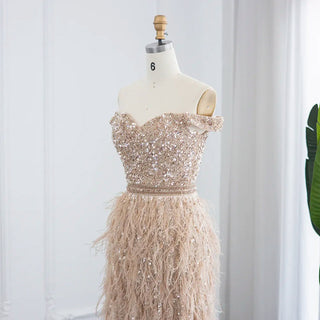 Golden Plume Elegance: Champagne Mermaid Evening Gown with Dubai-Inspired Feathers - Off-the-Shoulder Grandeur for Proms and Formal Events.